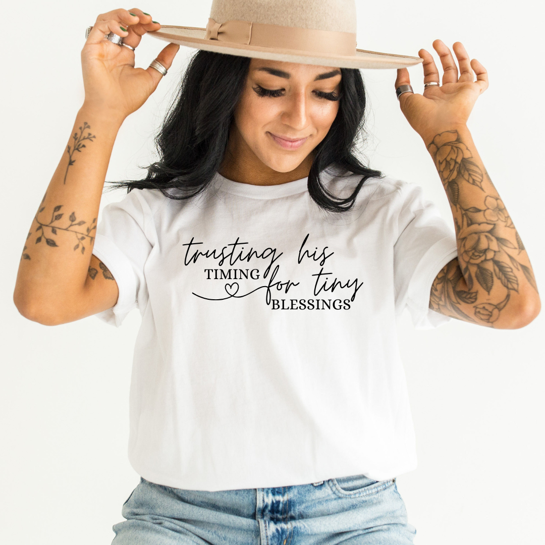 Custom printed T-shirt made by Colorful Hive, worn with a tan hat