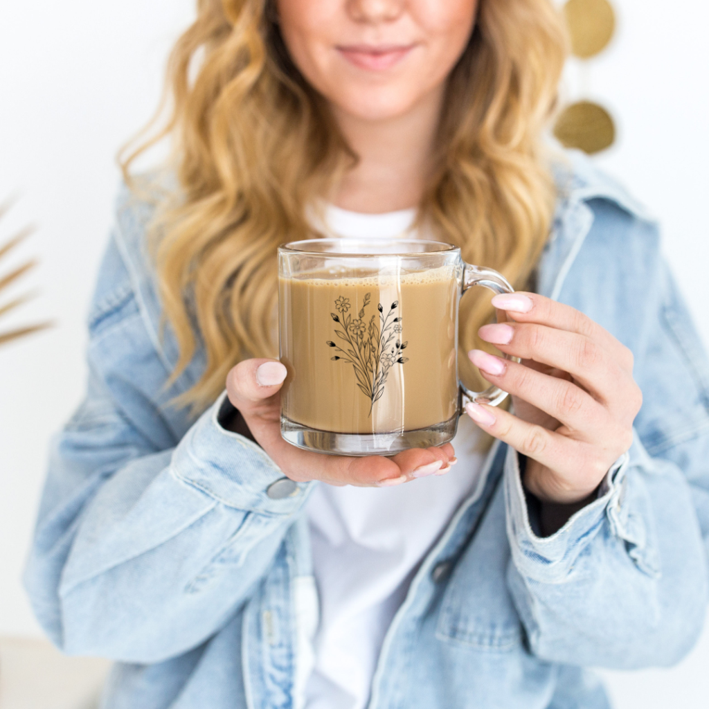 A personalized glass cup with a printed design
